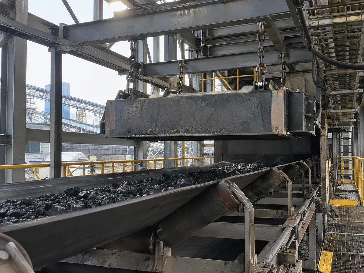 Conceptual suspended magnet installed above a coal conveyor
