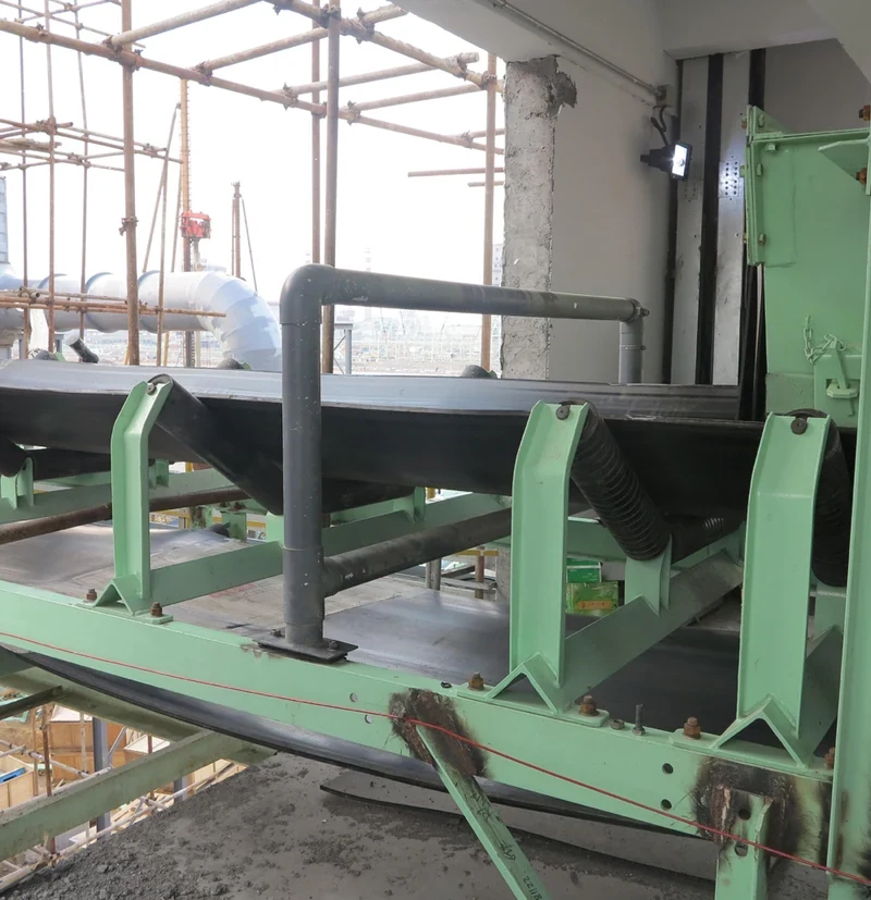 Conveyor metal detector frame shown on an industrial belt conveyor installation