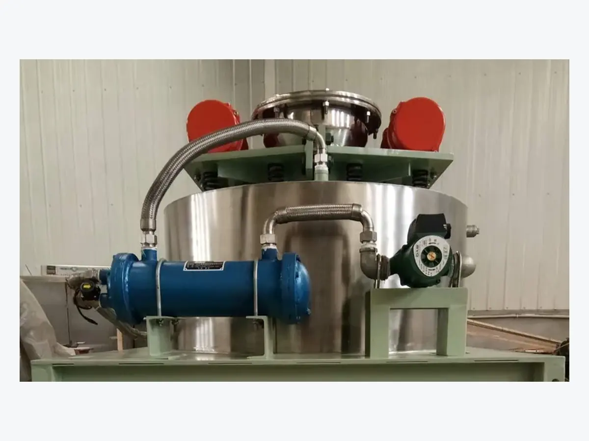 Twin vibration motors and upper feed section of a high-intensity magnetic filter